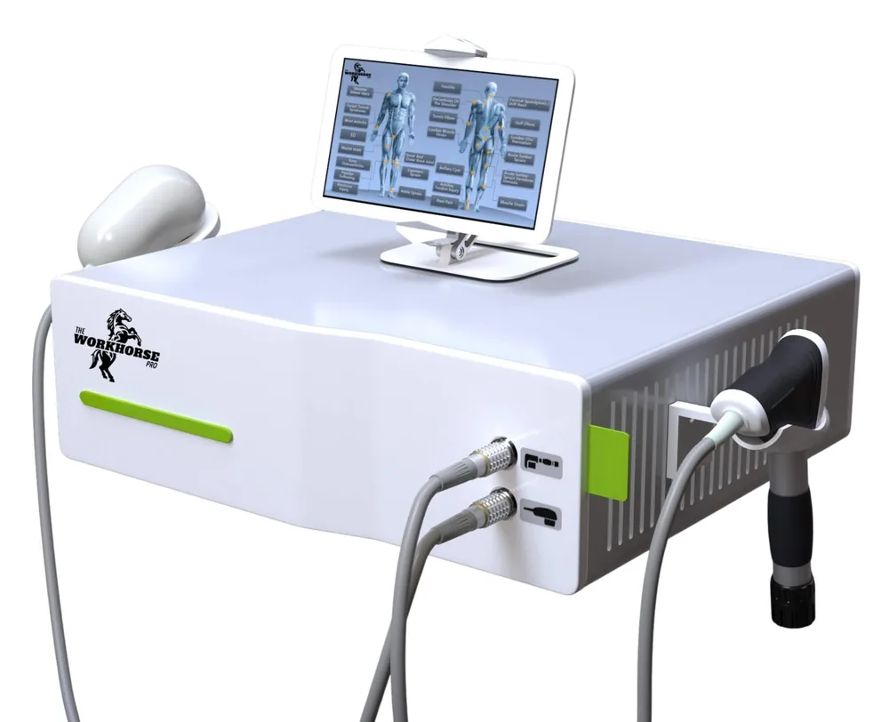 Workhorse Pro console with its touchscreen, shockwave handpiece and massage handle