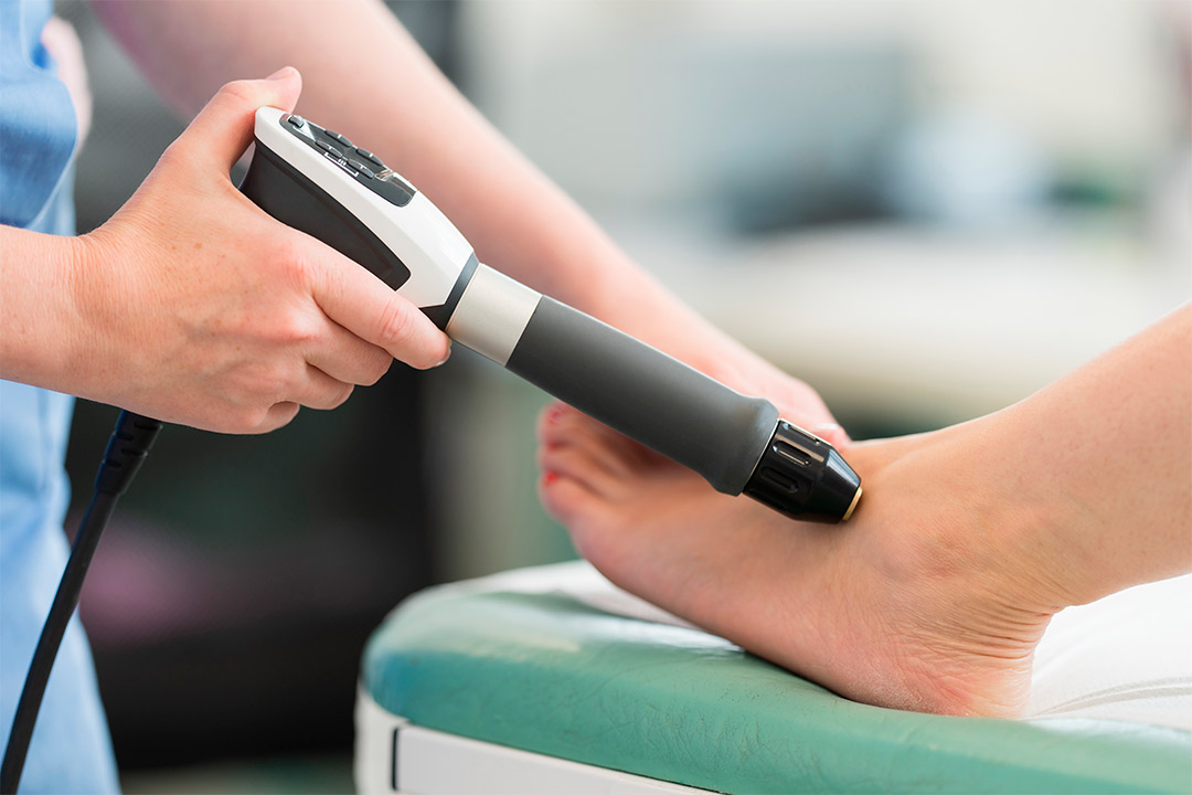device to measure foot size for safe at-home shockwave therapy during fall sports recovery.